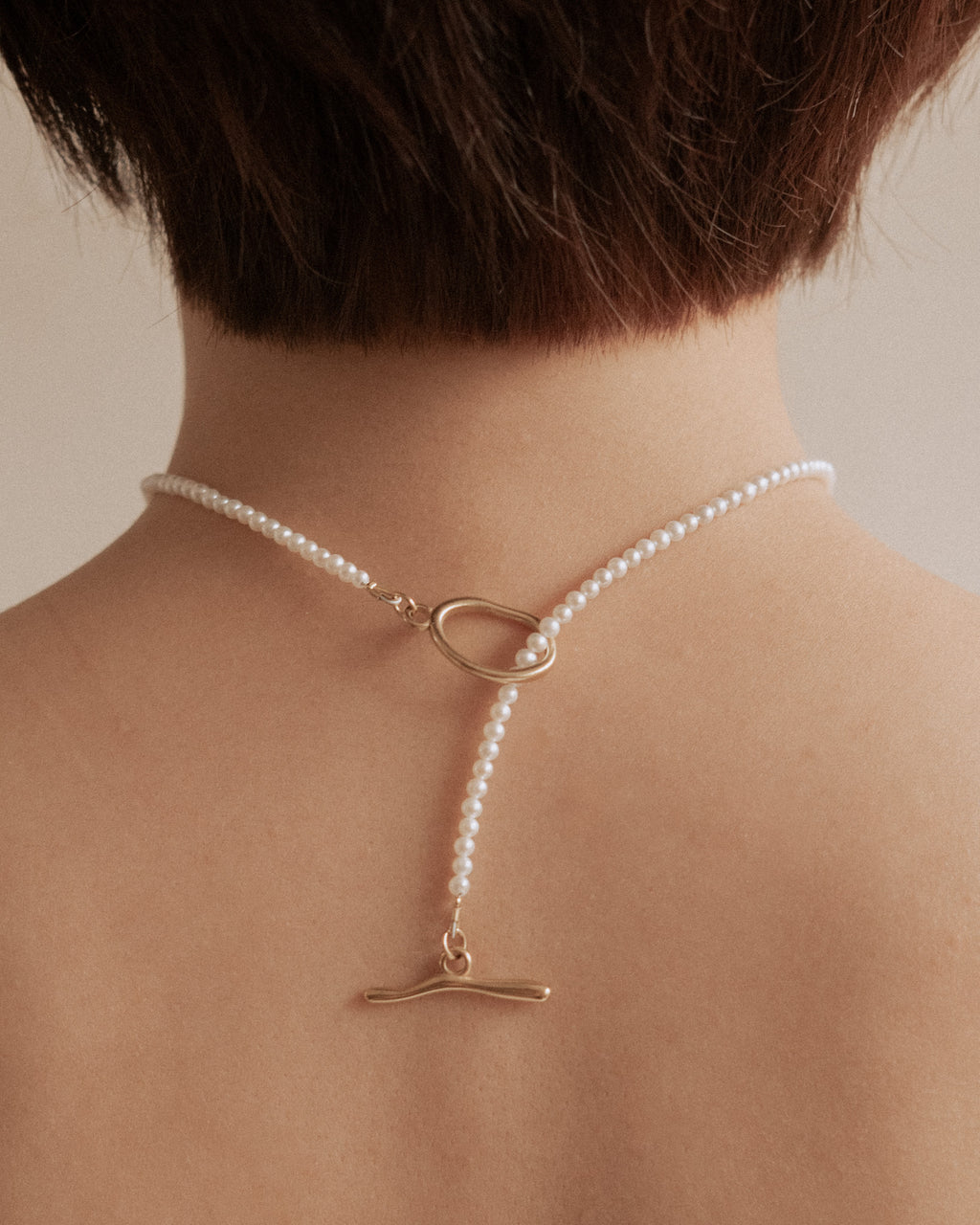 ______ 's Mneme Pearl Necklace