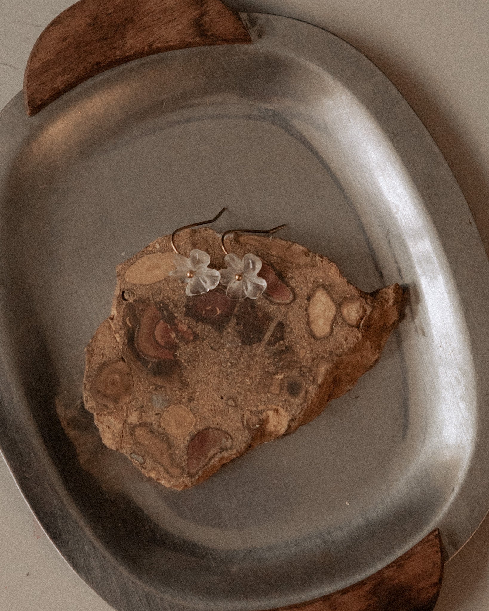 ______ 's Mneme Earring